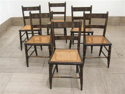 Six painted and stenciled thumb back cane seated side chairs