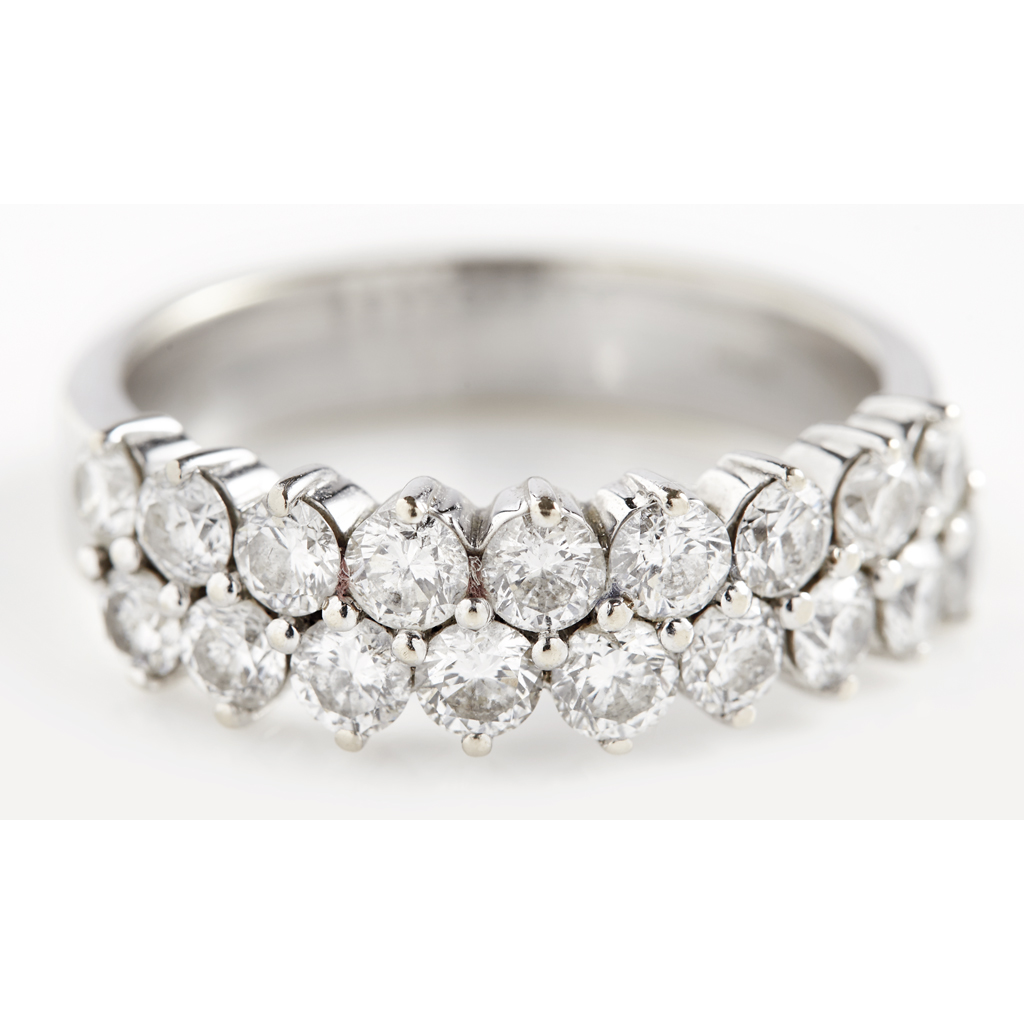 A diamond set half eternity ring claw set with two