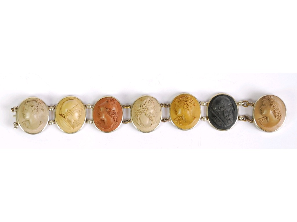 NINETEENTH CENTURY CARVED LAVA CAMEO BRACELET comprising seven oval varicoloured