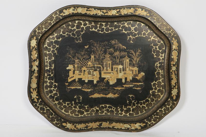 A PAPIER MACHE TEA TRAY of cartouche shape with a