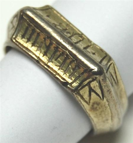 An antique gentleman s silver gilt ring the bevelled front