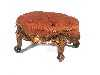A VICTORIAN CARVED WALNUT OVAL FOOT STOOL in the original