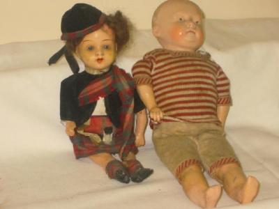 A composition shoulder head boy doll with painted face and