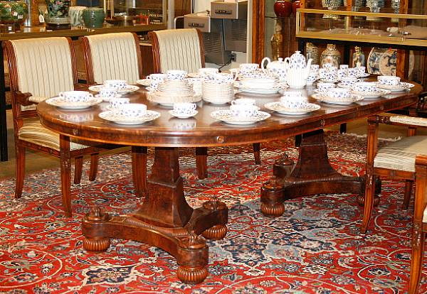 A Charles X style inlaid mahogany double pedestal dining table