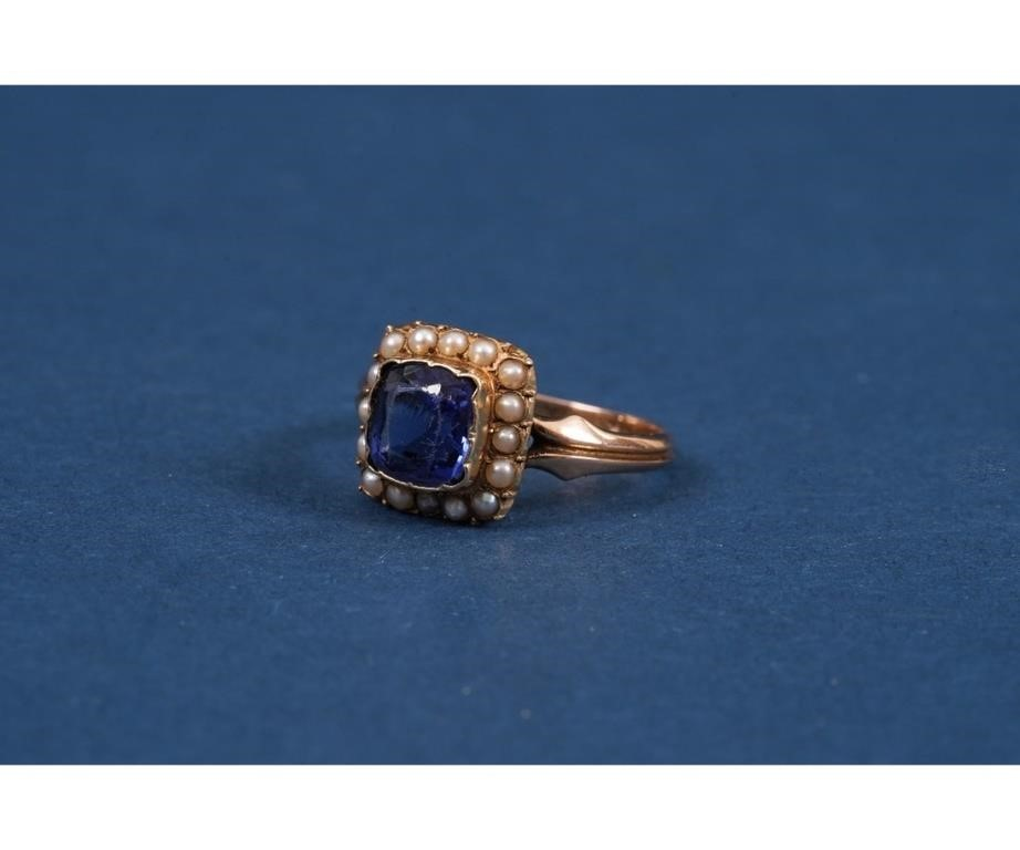 14k gold tested ladies ring with center blue stone and