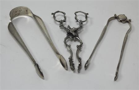 A pair of cast silver novelty sugar tongs in the