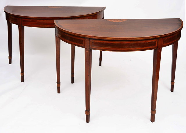 A PAIR OF GEORGE III MAHOGANY HALF ROUND SIDE TABLES