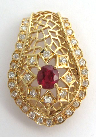 RUBY DIAMOND AND FOURTEEN KARAT GOLD PENDANT set with an