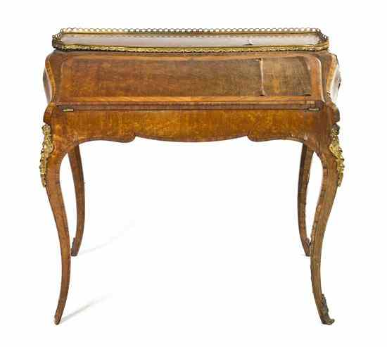 An English Maple Lady s Writing Desk having a three