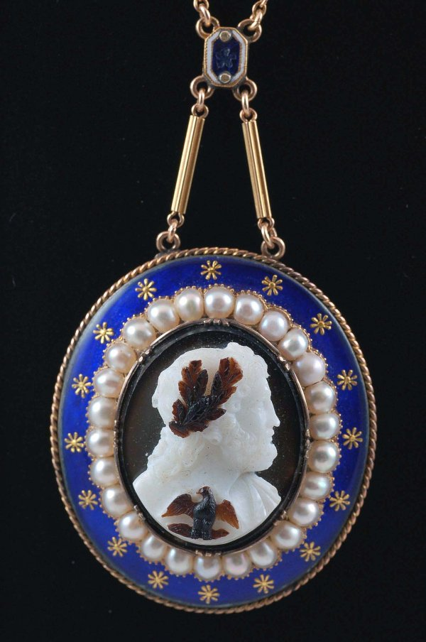 Finely carved hardstone cameo set in blue enameled frame with