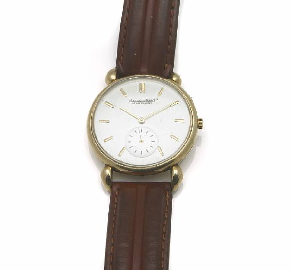 IWC An 18k gold circular cased wristwatch with heavy shoulders