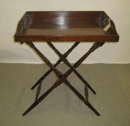 A MAHOGANY BUTLER S TRAY ON STAND 19th century the