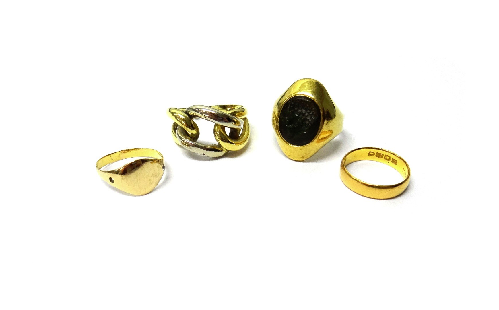 A 22ct gold wedding ring London 1901 an oval intaglio