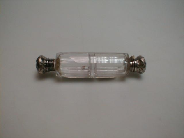 A 19thC double ended clear glass scent bottle with a
