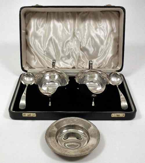 A pair of George VI silver oval sauce boats with
