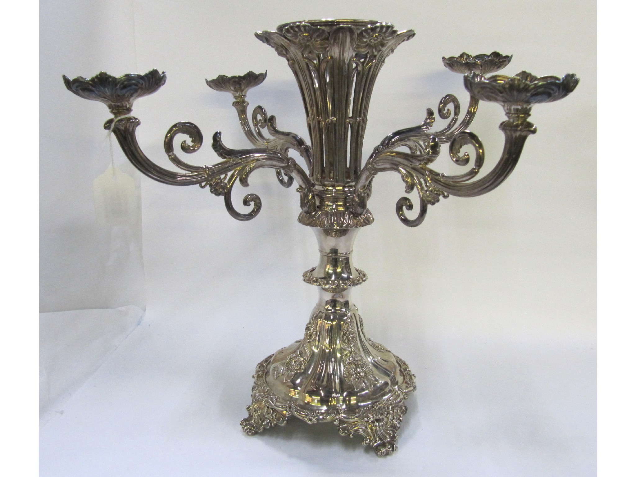 A silver plated centrepiece epergne missing glass bowls