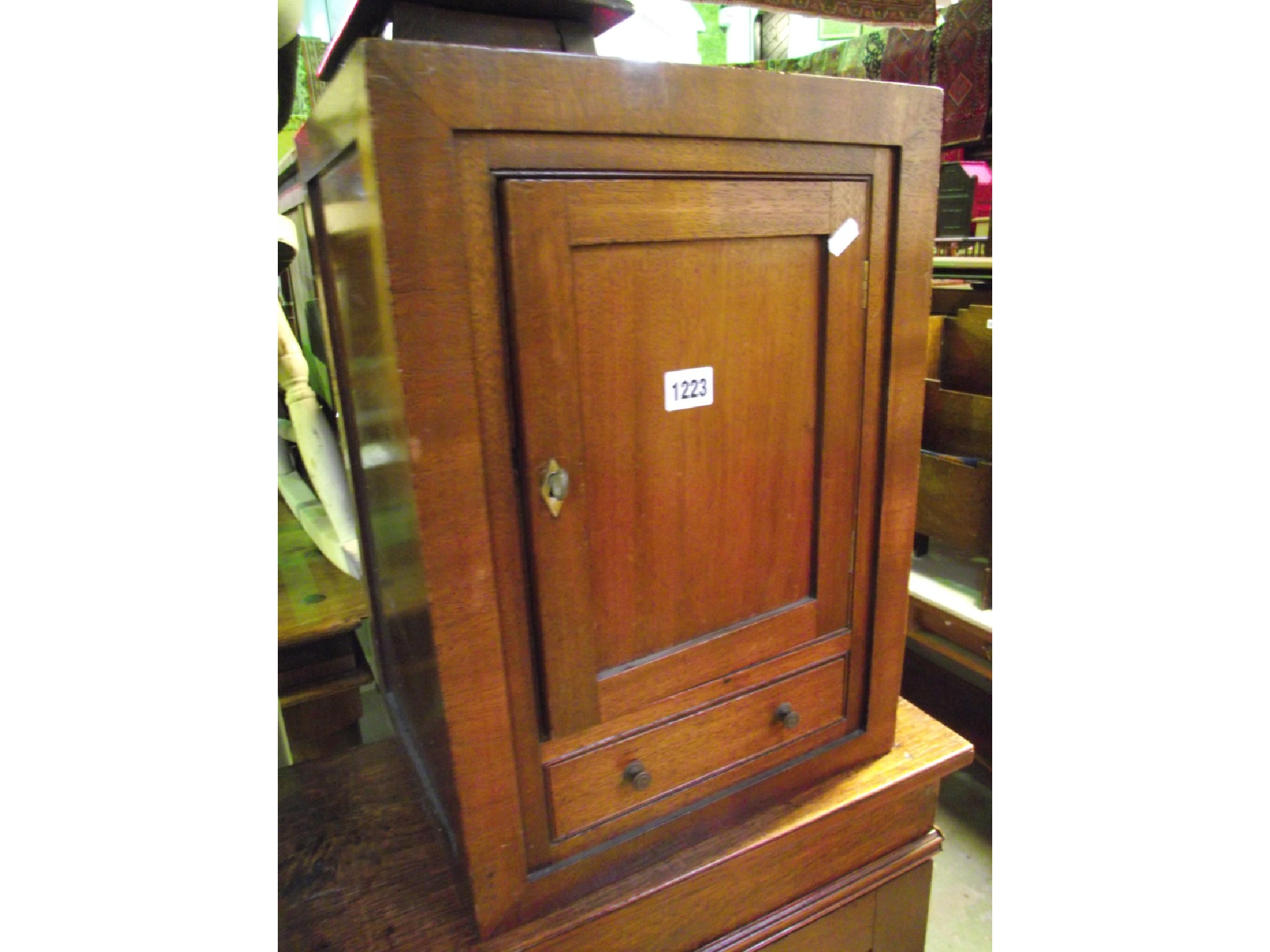 A small vintage display case with tapered and enclosed glazed