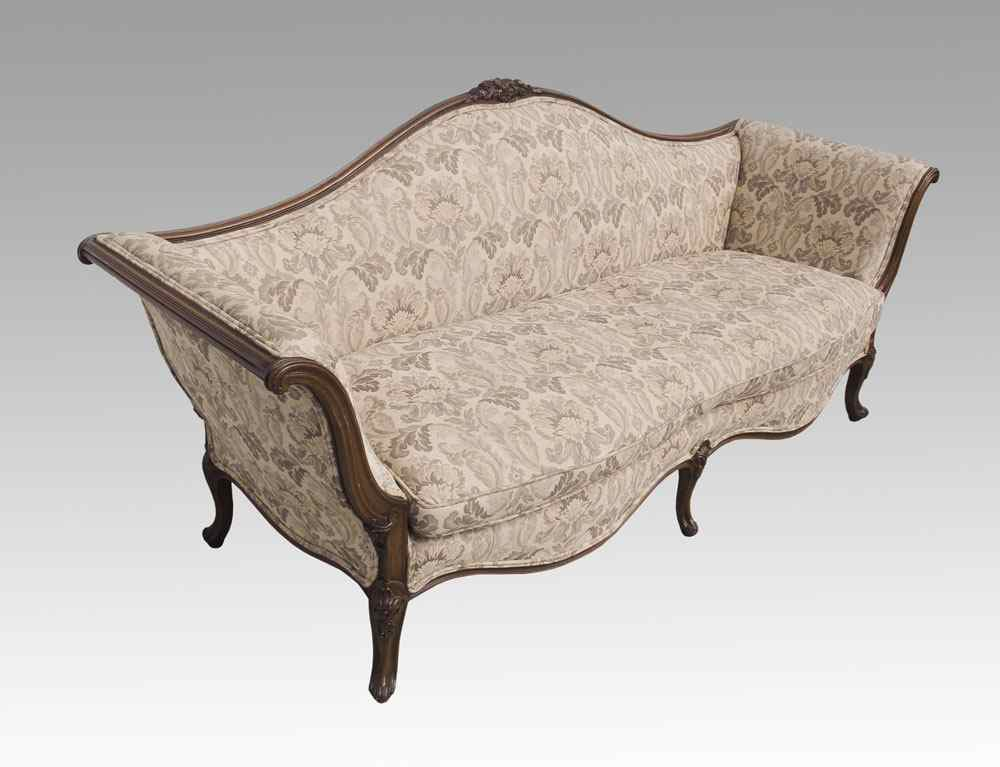 CARVED VICTORIAN SOFA Carved frame and feet with foliate scroll