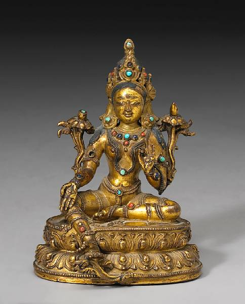 A small Tibetan gilt bronze figure of Green Tara 17th