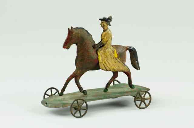 WOMAN RIDING HORSE PULL TOY Attributed to Hull Strafford early