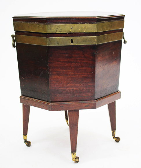 A GEORGE III MAHOGANY OCTAGONAL BRASS BOUND CELLARETTE with carrying