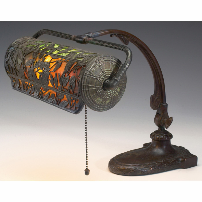 Handel lamp adjustable bronzed metal base holding a cylindrical bent