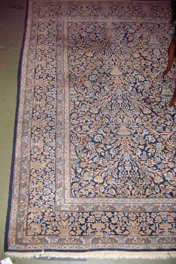KIRMAN old Blue central field patterned throughout with vases in