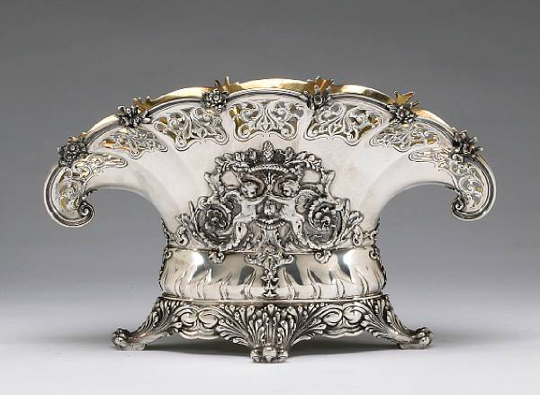 Of oval section the paneled fan shaped sides centered with