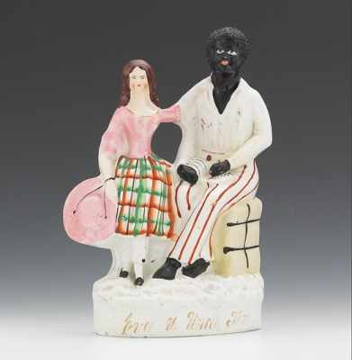 A Staffordshire Figural Group of Uncle Tom Eva With Uncle