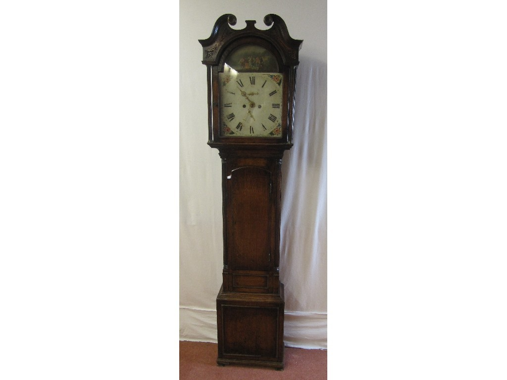 A Victorian oak longcase clock the hood bearing a carved
