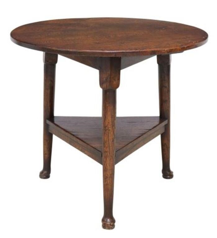 English oak cricket table 20th c round tabletop medial shelf
