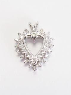 Description A 14K white gold heart shaped pendant with thirty