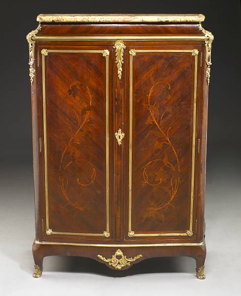 A Louis XV style gilt bronze mounted marquetry inlaid kingwood