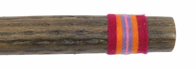 Rain stick made from a hollowed dried cactus with thorns