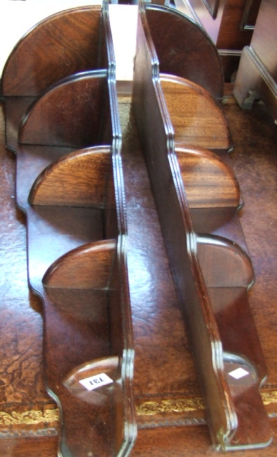 A pair of mahogany graduated corner shelves and a pair
