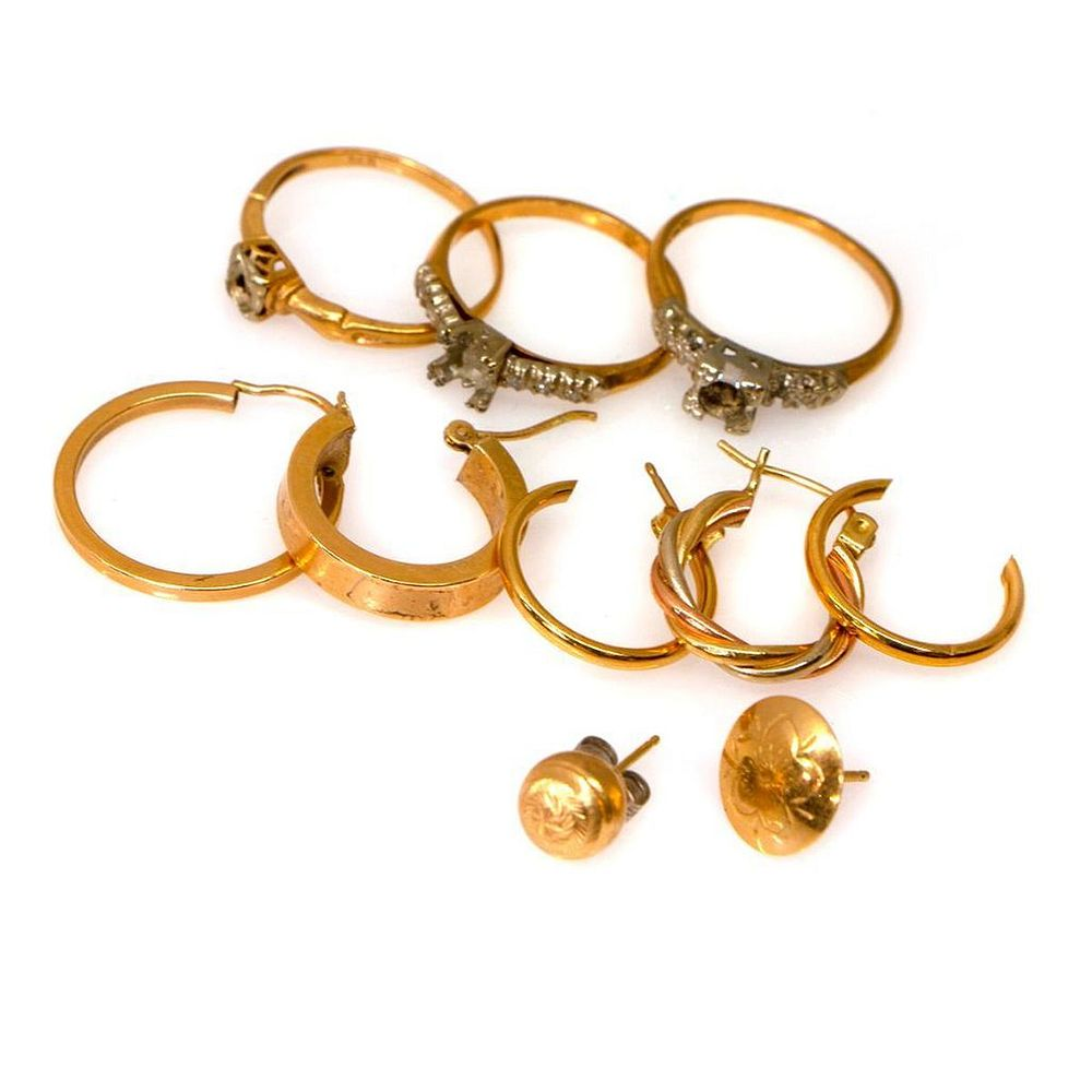 Collection of 14k gold jewelry including single earrings and semi
