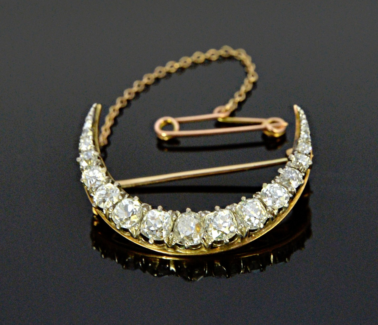 A gold backed and silver fronted diamond set brooch designed
