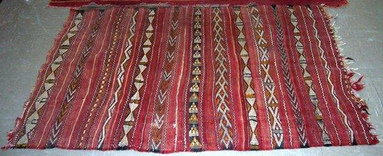A Moroccan rug bands on a crimson ground 260cm x