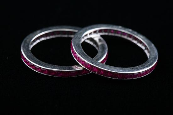 PAIR WHITE GOLD AND RUBY GUARD RINGS Each with circle