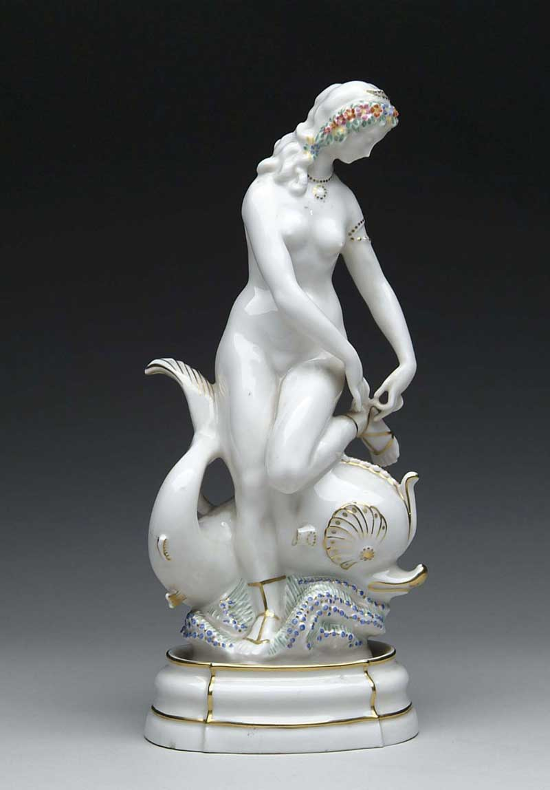 PORCELAIN GILT AND PAINTED FIGURE OF A NUDE MAIDEN WITH