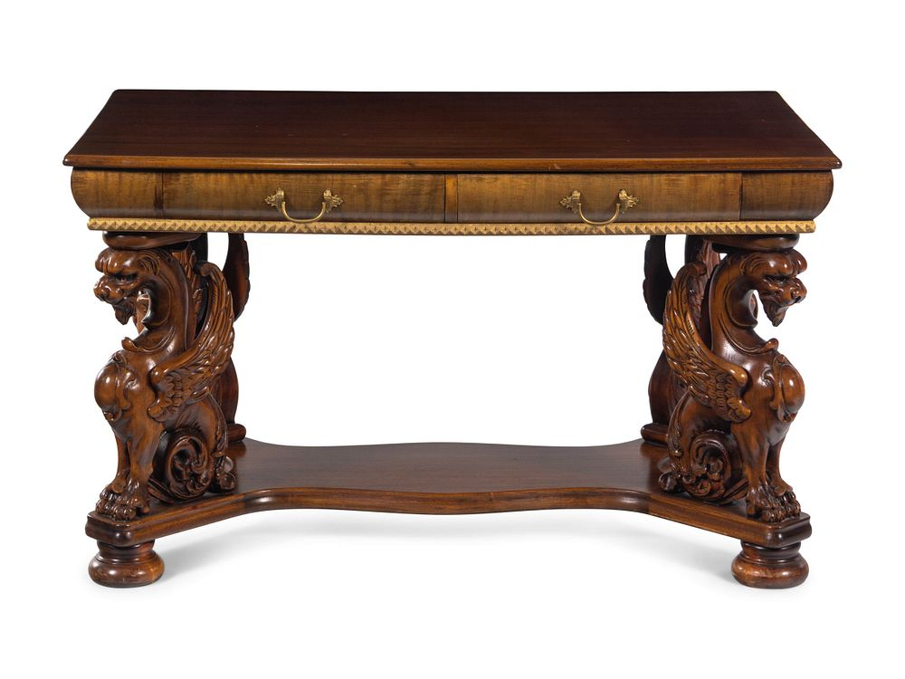 A Renaissance Revival Carved Walnut Library Table A Renaissance Revival