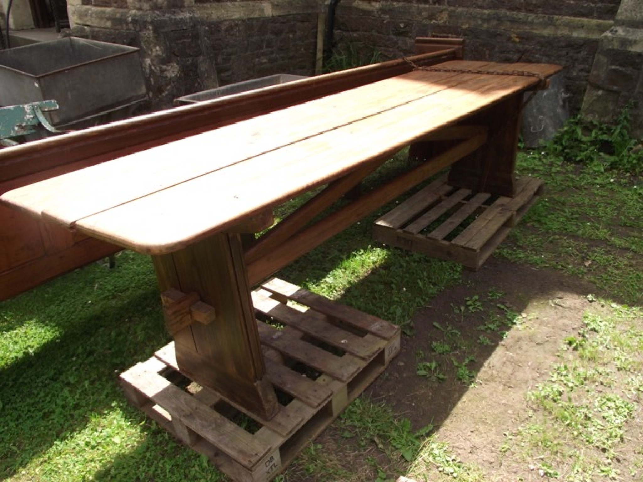 A pitch pine refectory table the rectangular boarded top with