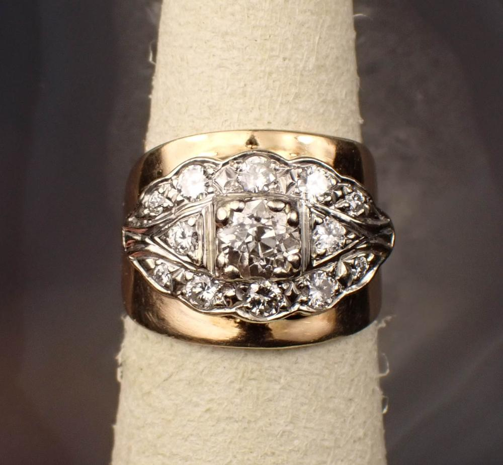 ESTATE DIAMOND AND FOURTEEN KARAT GOLD RING The white and