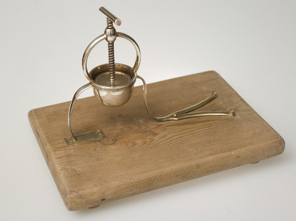LATE 19th CENTURY SILVER PLATED LEMON SQUEEZER mounted on a