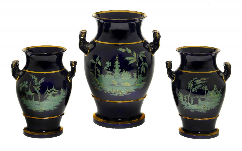 A RARE BRAMELD COBALT GROUND EARTHENWARE GARNITURE OF THREE VASES