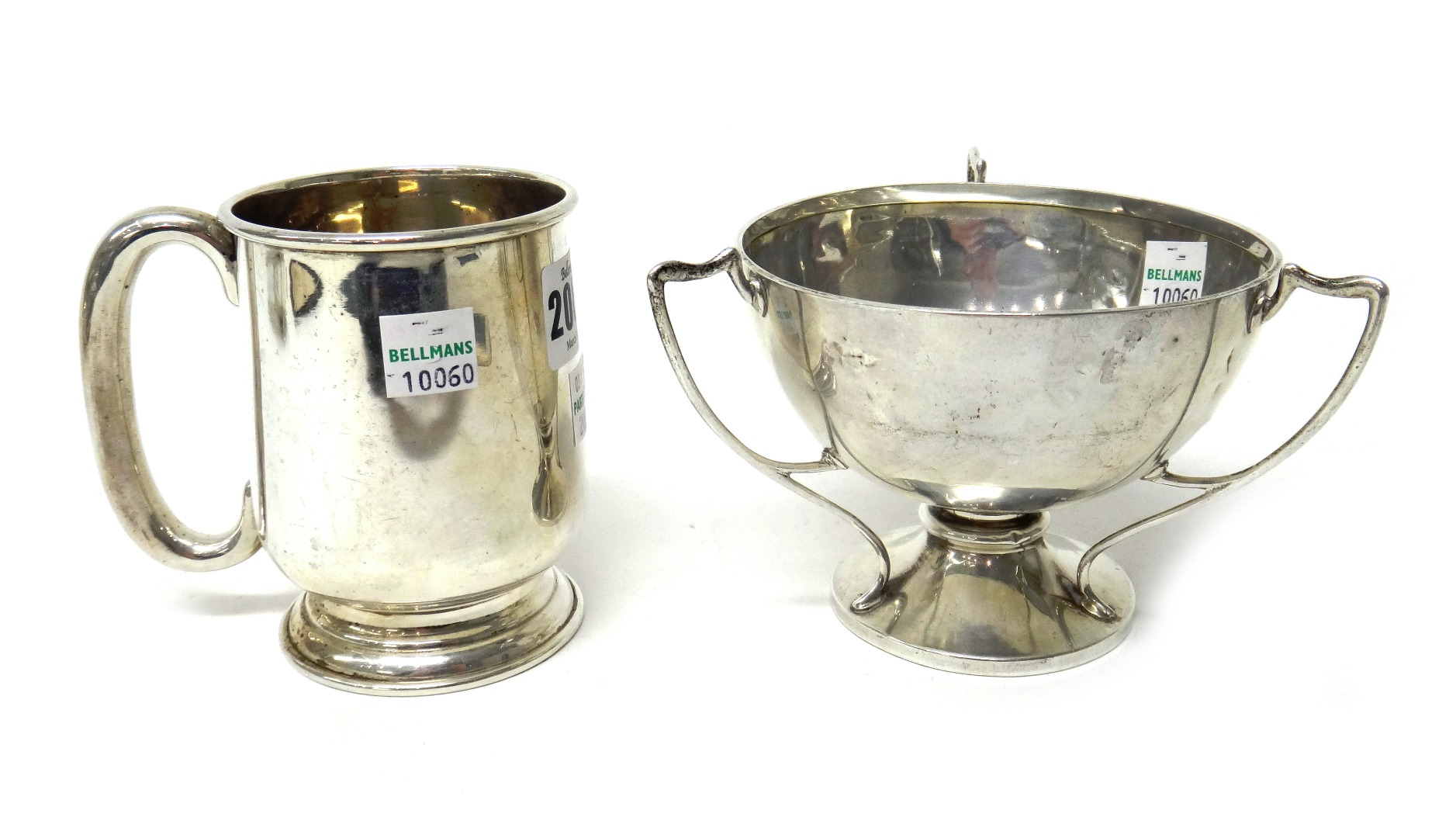 Silver comprising a mug with a C shaped handle on