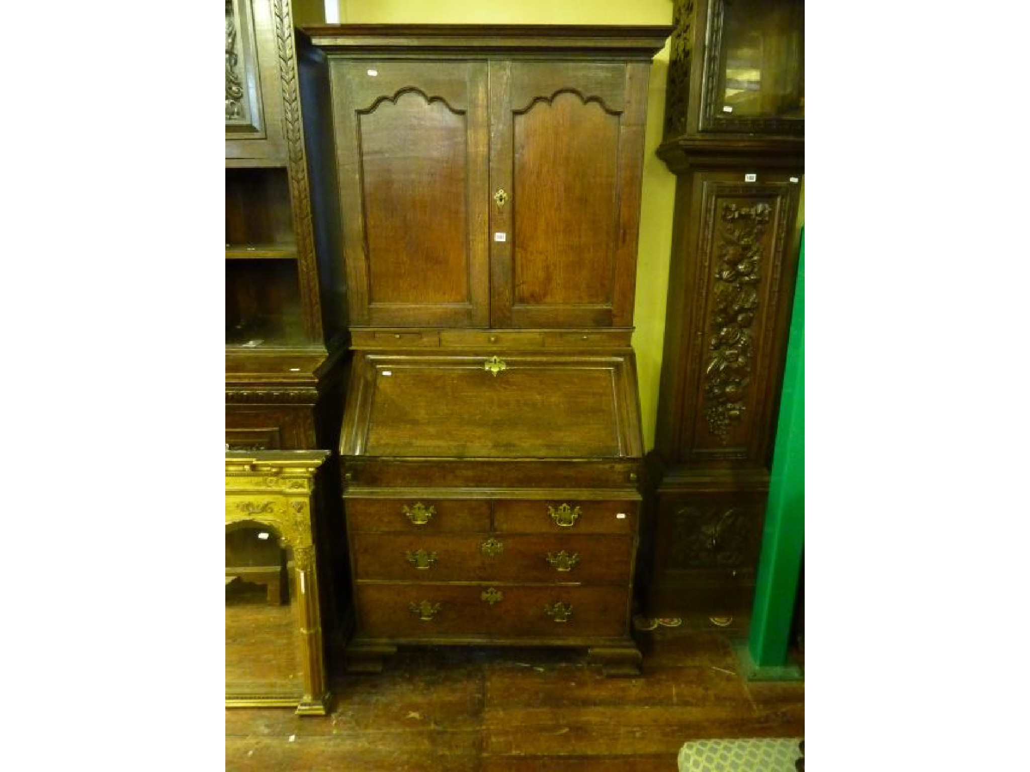 An 18th century oak bureau bookcase the bureau fitted with