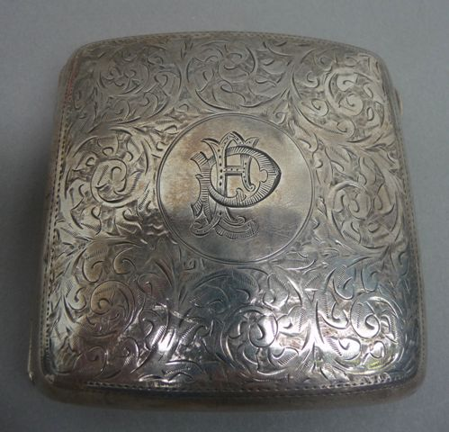 An Edwardian sterling silver cigarette case With chased scroll decoration