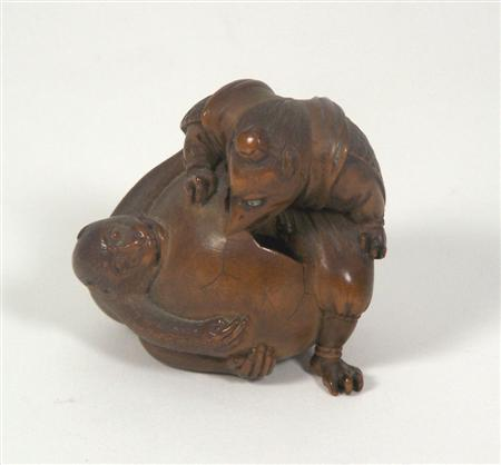 A Japanese wood okimono Meiji period Signed Itsumin Doji depicting