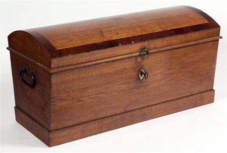 A 19th century oak and mahogany crossbanded German trunk the